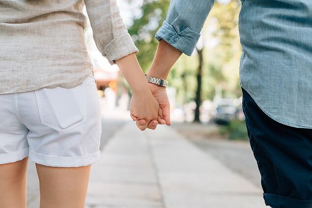 A man without problems with potency holds a woman's hand
